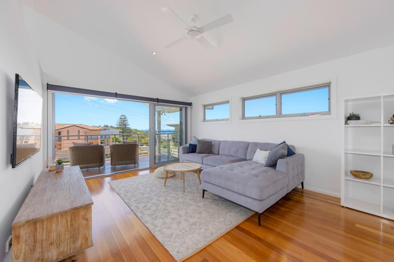 Upstairs lounge room with lovely views, leading out to balcony. It has air co, ceiling fan and smart TV. Laze at Lighthouse