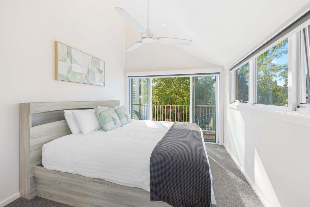Bedroom 1 with queens bed, ensuite and private balcony. Noahs Beach House
