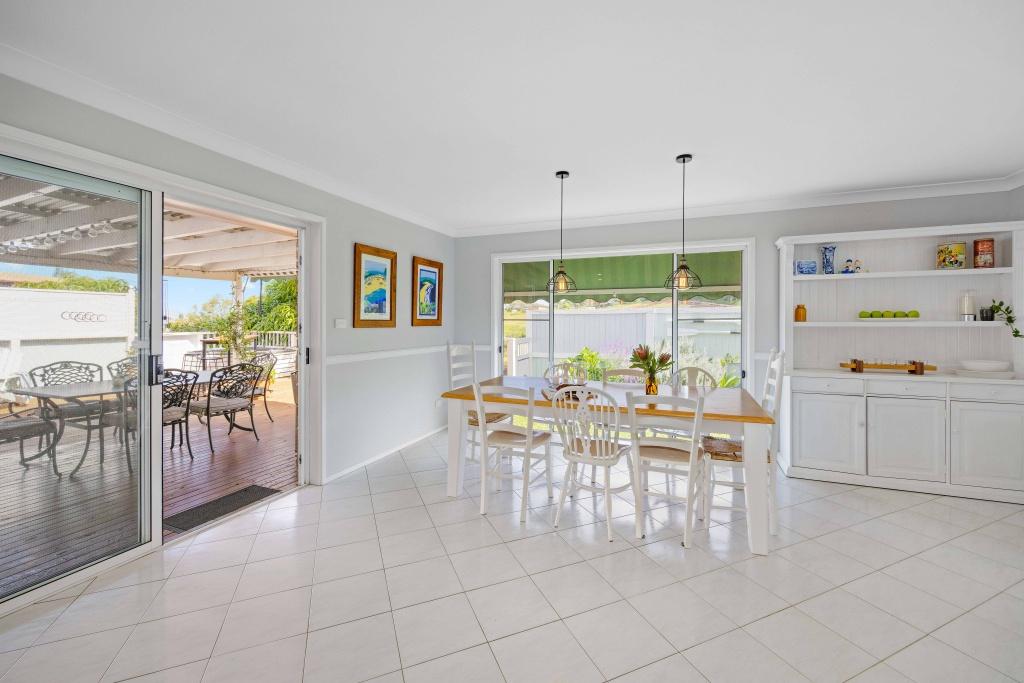 Open kitchen and dining leading out to outdoor dining area. Lighthouse Vaccay