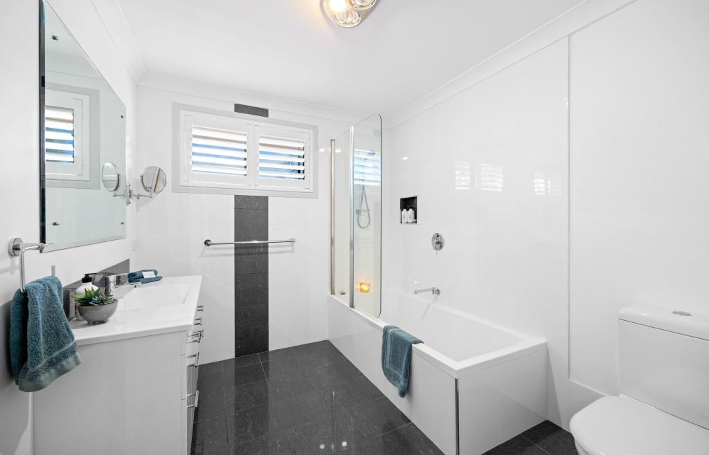 Full bathroom upstairs with step in shower over bath and toilet