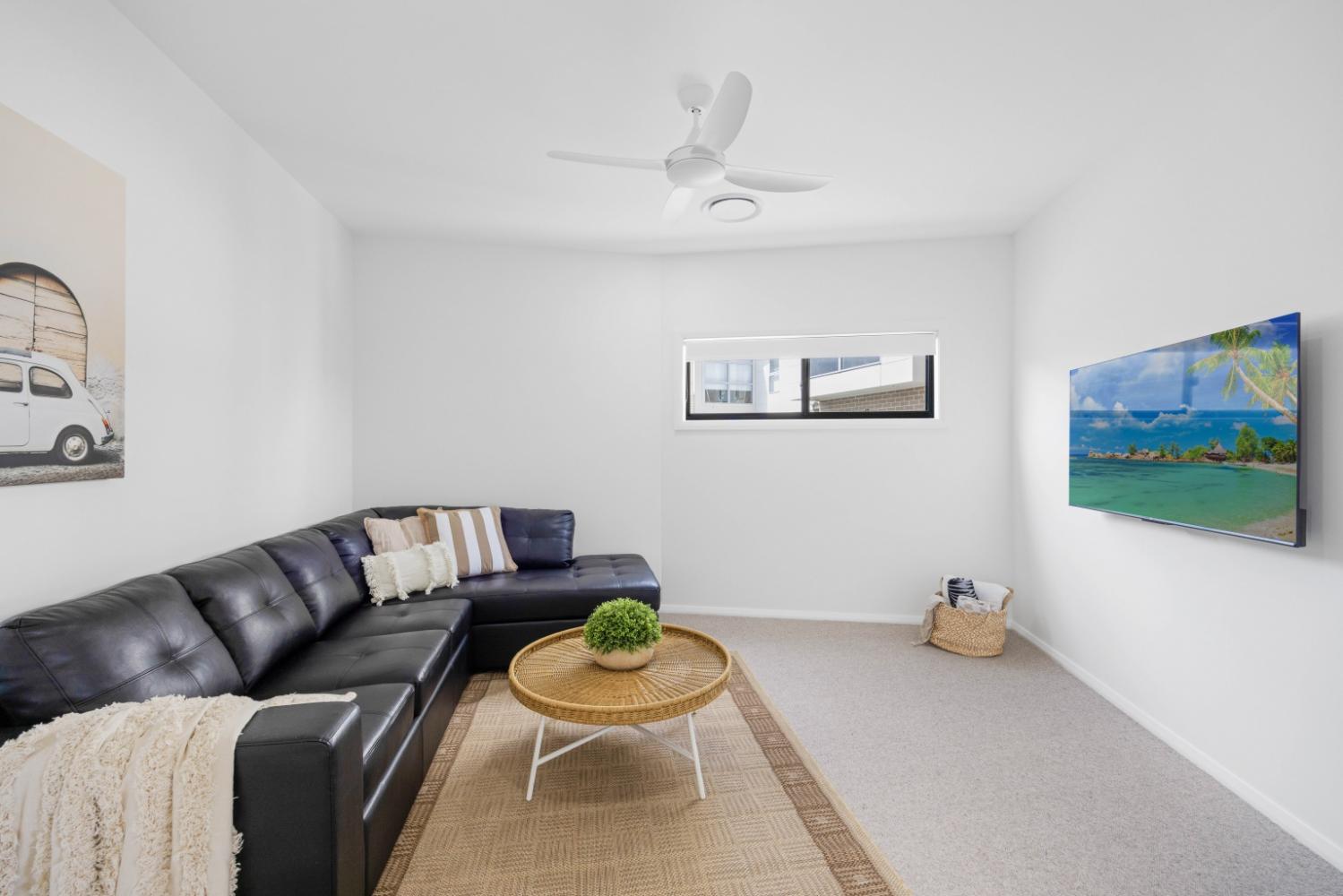 Lounge room with aircon and smart TV. Hamiltons