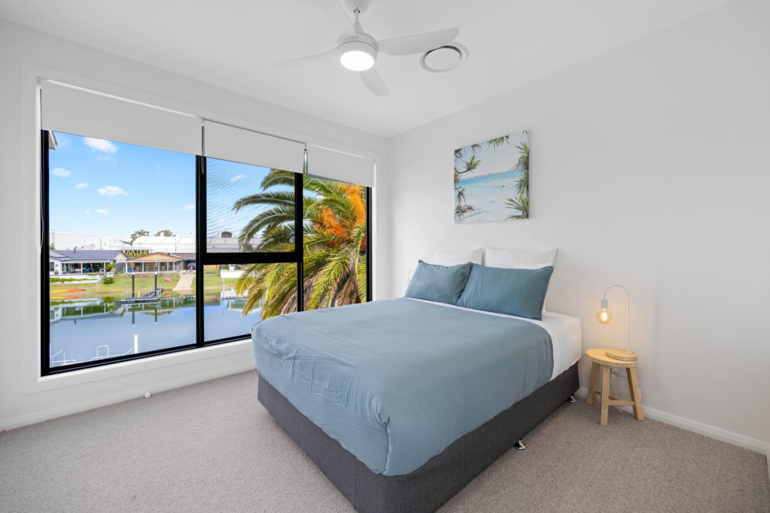 Third bedroom with queen bed and Canal views. Hamiltons