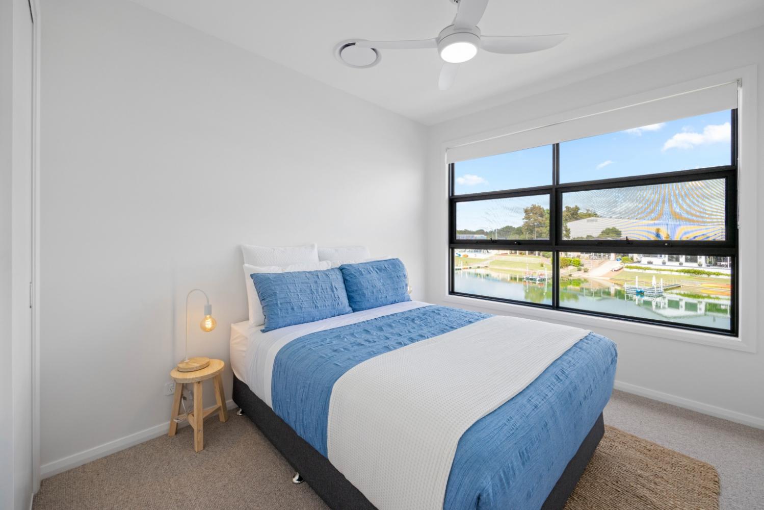 Second bedroom with queen bed and Canal views. Hamiltons