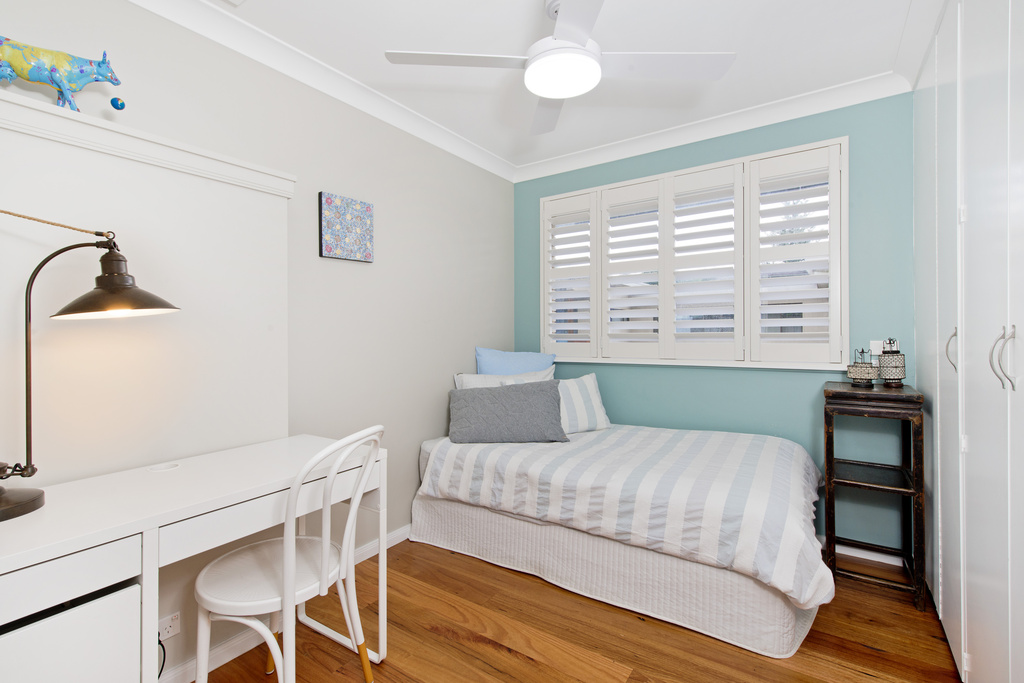 Third bedroom upstairs with single bed and ceiling fan Apricari oasis by the sea Bonny Hills