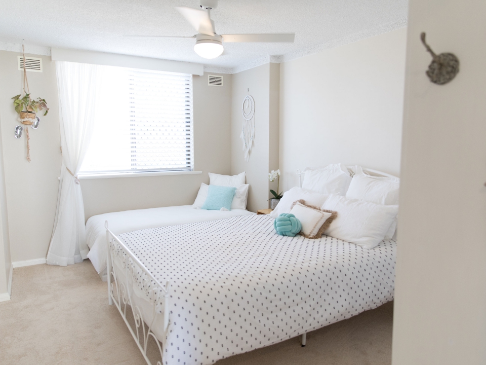 Third bedroom with queen bed, single bed and ceiling fan. Beauty at the Beach