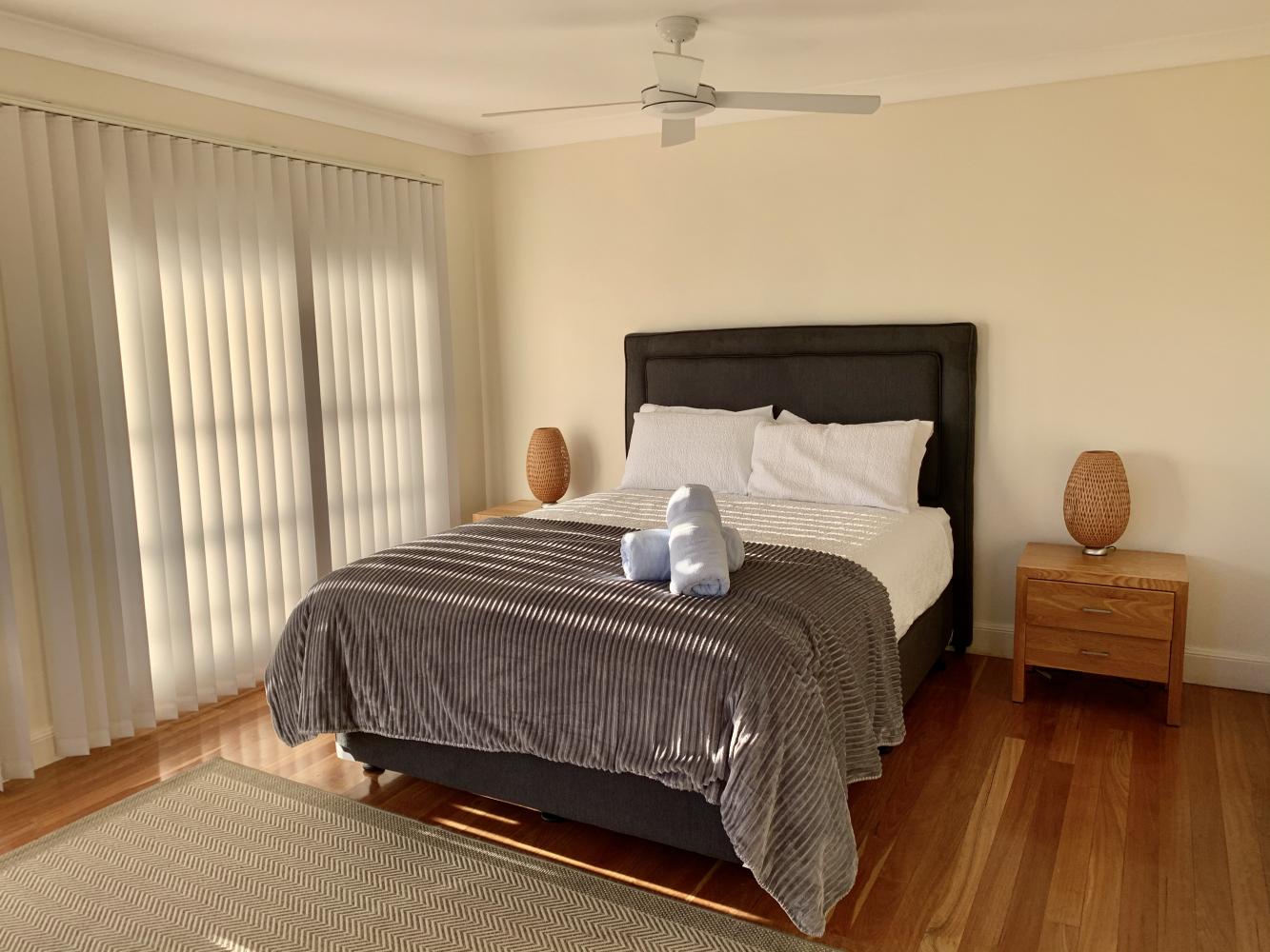 Main bedroom with private balcony, ensuite and walk in wardrobe. Illalangi