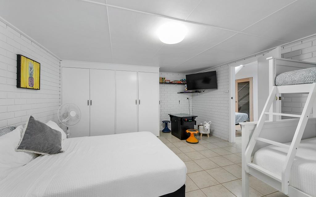 Downstairs rumpus room/ fourth bedroom with Queen bed, single bed and bunk beds- Single on top, double on bottom. Sleeps 6. Harrys @ Shelly Beach
